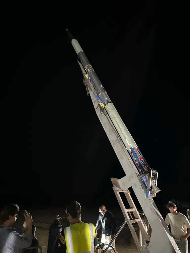 VEGA being raised on the launch rail at night